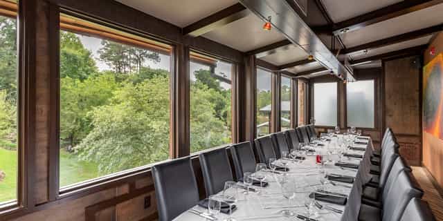 Private dining room at Brennan's of Houston with elegant table, ideal for corporate events.