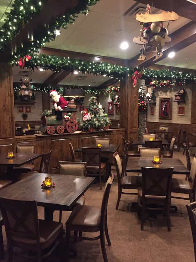 Festive restaurant event space with Christmas tree, ideal for holiday parties.