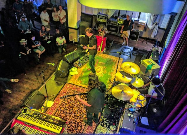 Blues club live music event in Houston with intimate stage and engaged audience.