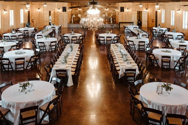 Elegant banquet hall with round tables, perfect for weddings and formal events.