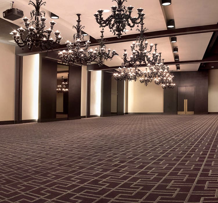 Elegant event space at The Moran Meeting & Event Center with chandeliers, ideal for gatherings.