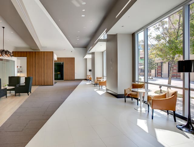 Modern hotel lobby with natural light, ideal for meetings and networking events.