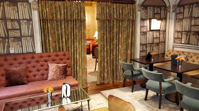 Elegant hotel bar with plush seating, perfect for meetings and networking events.