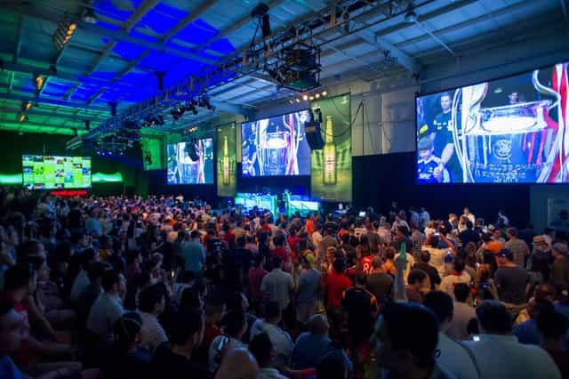 Raw warehouse space at Silver Street Studios for an esports tournament with vibrant lighting.