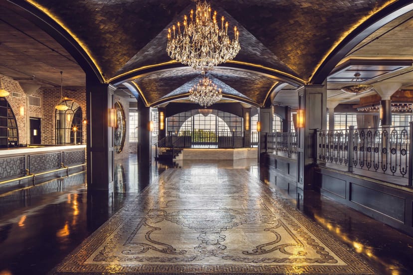 Grand Ballroom at The Astorian with elegant chandeliers, perfect for corporate events.