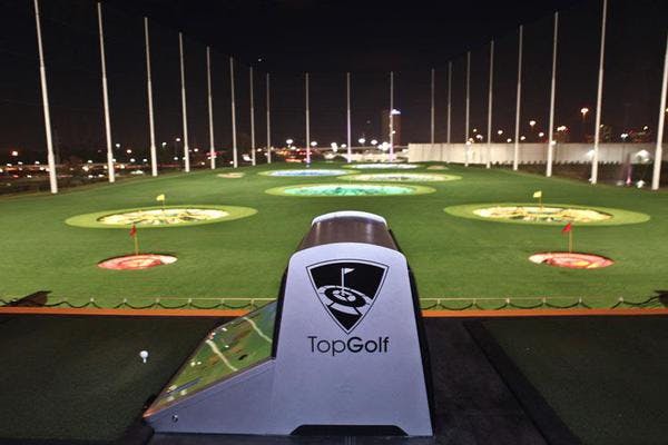 Topgolf Houston - Katy driving range at night, perfect for corporate events and team-building.
