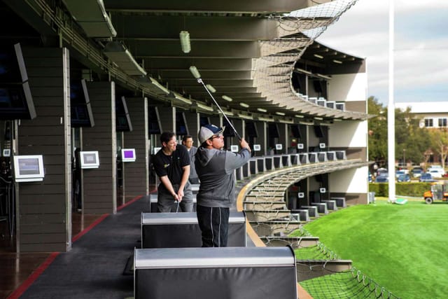 Modern driving range at Topgolf Houston - Katy, ideal for corporate events and team-building.