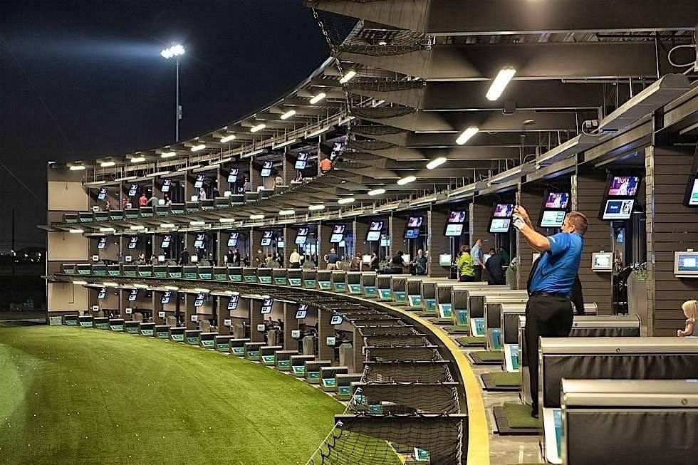 Topgolf Houston - Katy: modern driving range with tiered bays for corporate events and networking.