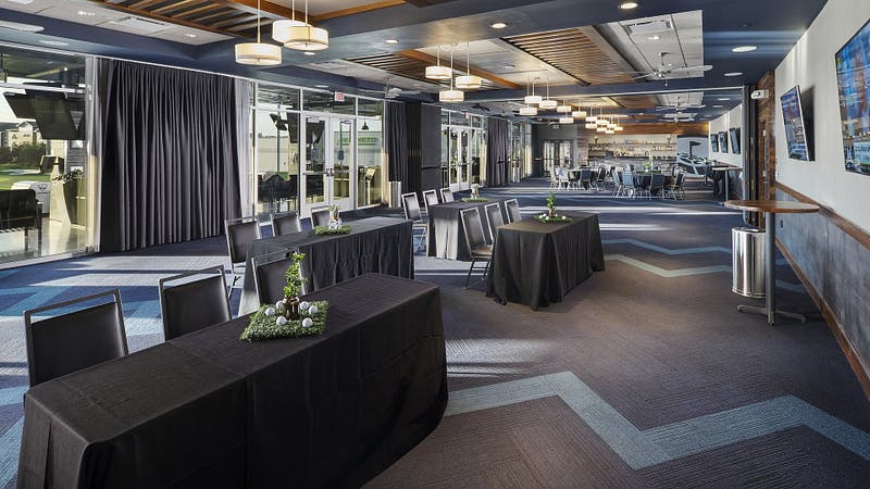 Event space at Topgolf Houston - Katy with modern decor for corporate gatherings.