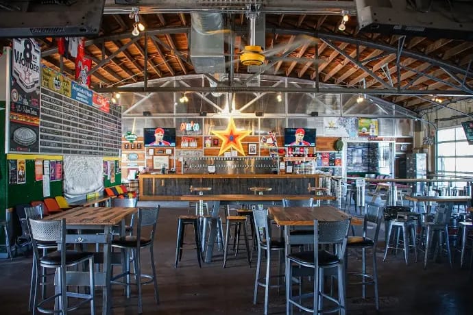 Brewery taproom with industrial-chic design, perfect for events and gatherings.