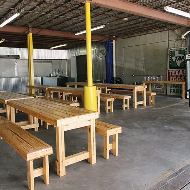 Spacious industrial taproom at Eureka Heights Brewery for team-building events.