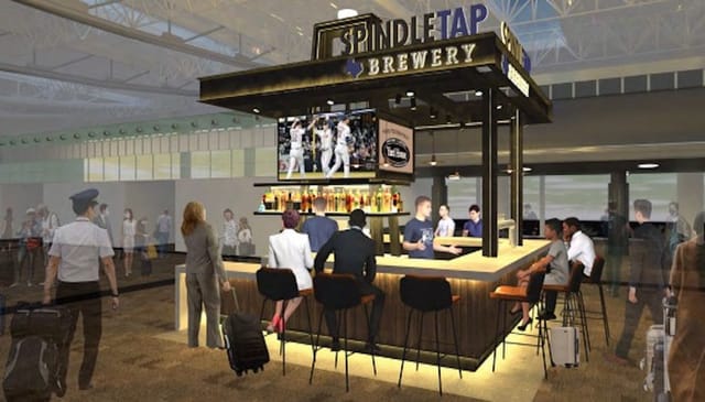 Modern brewery bar at SpindleTap, ideal for pre-flight gatherings and casual meetings.