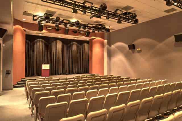 Auditorium with tiered seating at The Health Museum for events and presentations.
