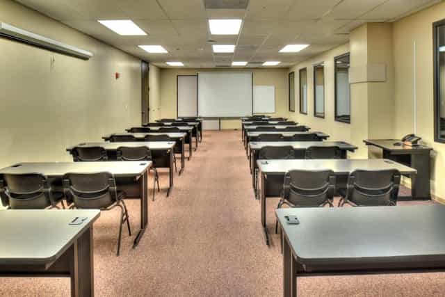 Grand Hall classroom setup with desks for training sessions and workshops at The Health Museum.