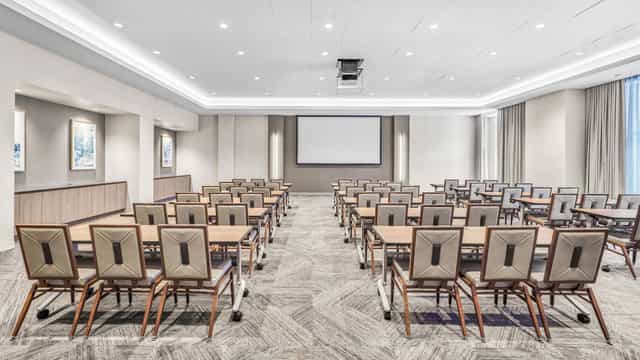Main Event Room in The Houston Room, featuring a large screen for workshops and presentations.