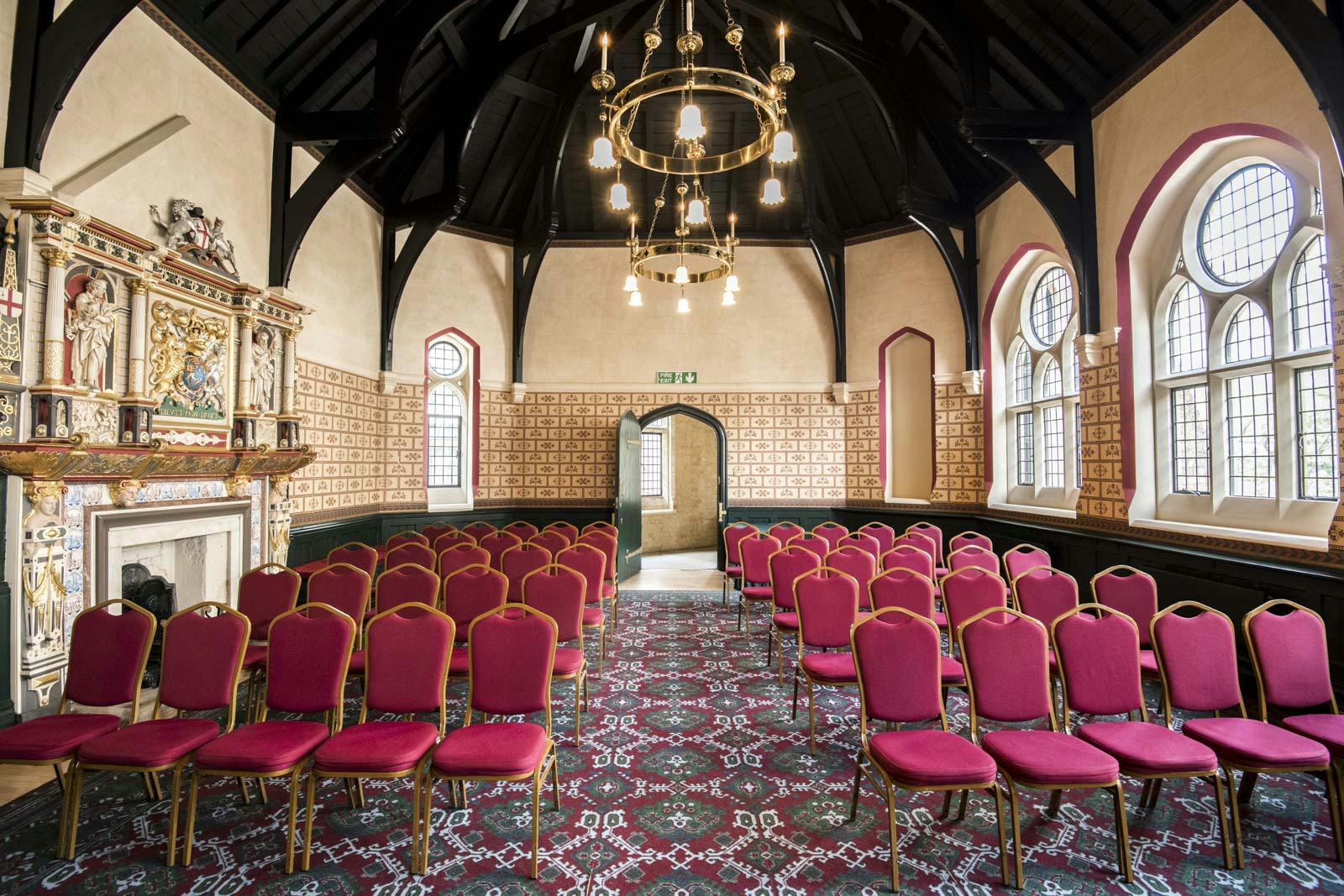 Courtroom in Holborn Venues with plush red chairs, ideal for workshops and conferences.