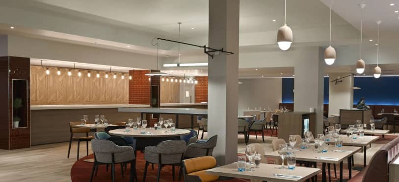 Modern dining space at Hyatt Place Heathrow, ideal for meetings and networking events.
