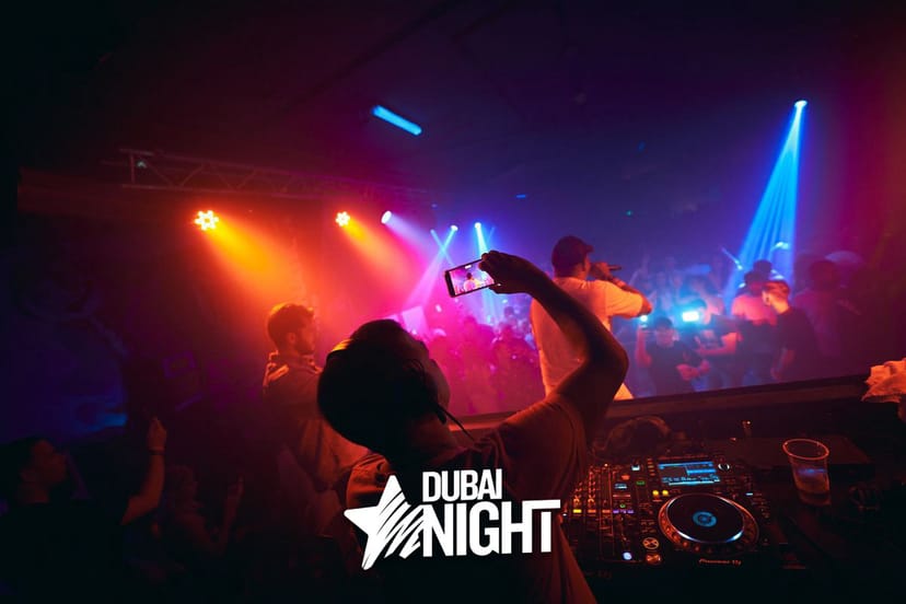 Vibrant nightclub scene with DJ and colorful lights at P7 Arena Club nightlife event.