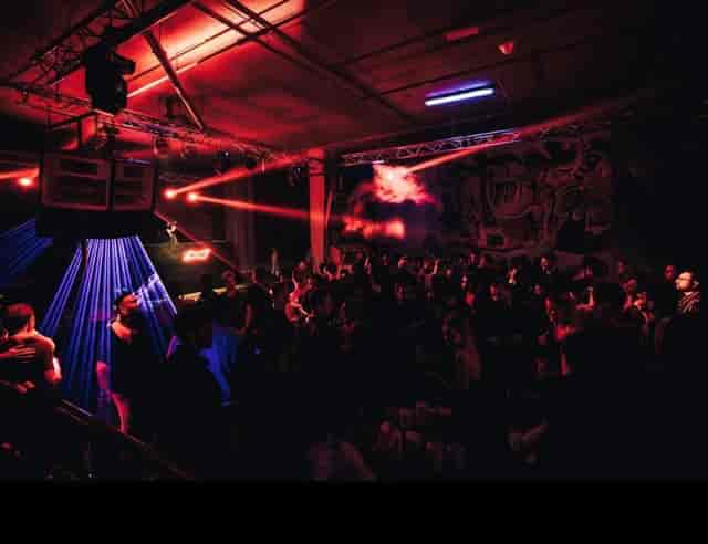 Vibrant P7 Arena event space with dynamic lighting for networking and entertainment.