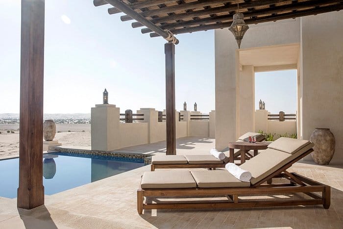Outdoor meeting space in Al Wathba resort with pool for corporate retreats and gatherings.