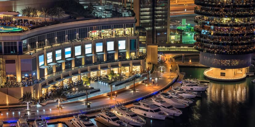 Dubai Marina Mall waterfront venue with illuminated buildings, ideal for upscale events.