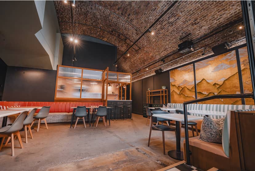 Industrial-chic event venue, exposed brick, urban vibe, corporate events, London