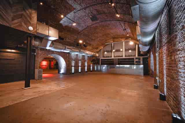 Industrial venue, brick, vaulted ceilings, event space, branding