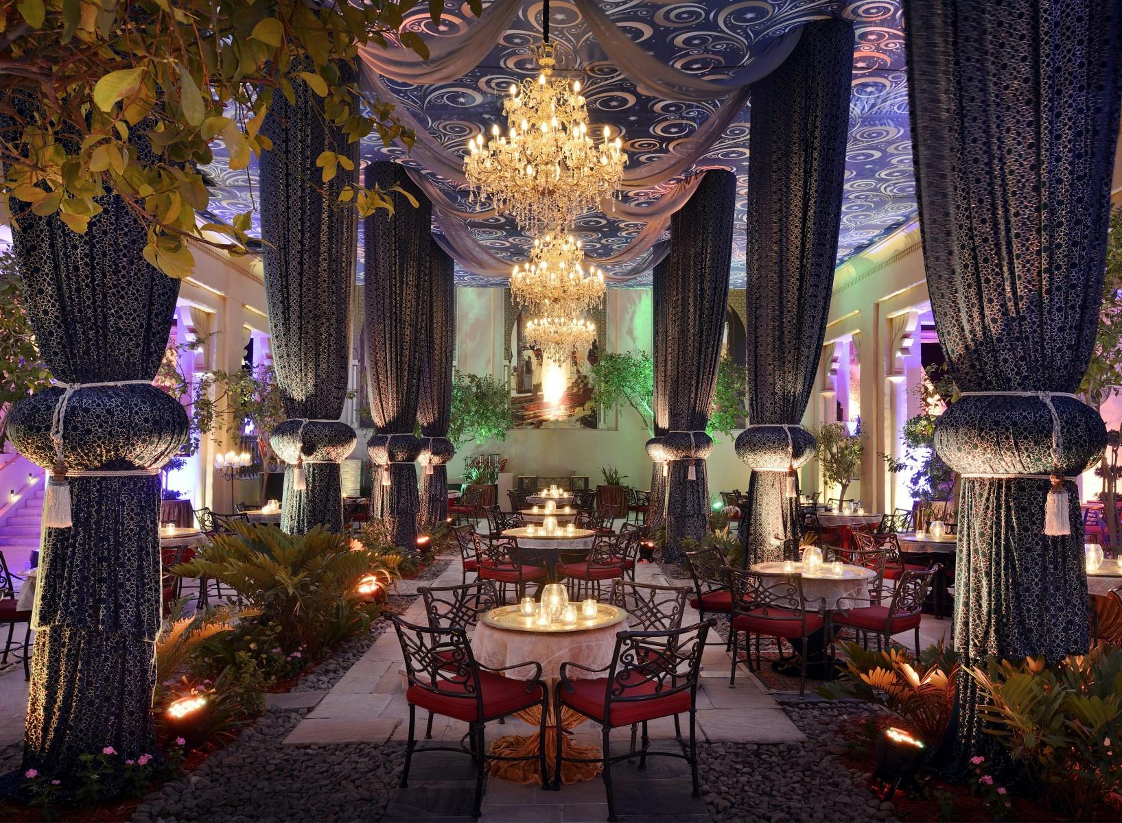 Elegant event space at One&Only Royal Mirage with grand chandelier for upscale celebrations.