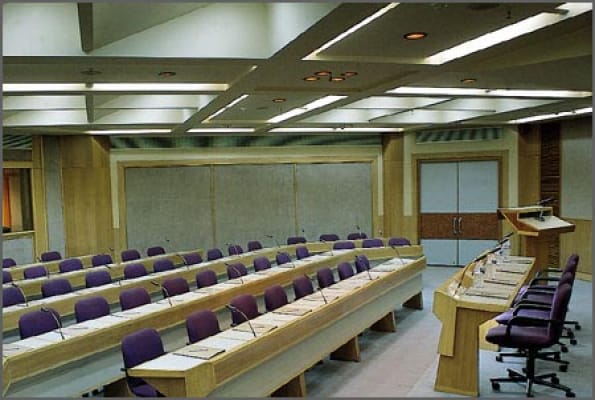 Banquet hall with tiered seating at India Habitat Centre for meetings and events.