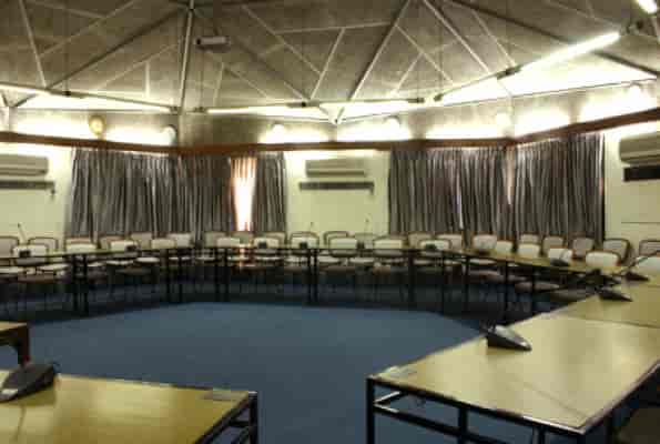 Banquet hall in India Habitat Centre, ideal for workshops and meetings with circular table layout.