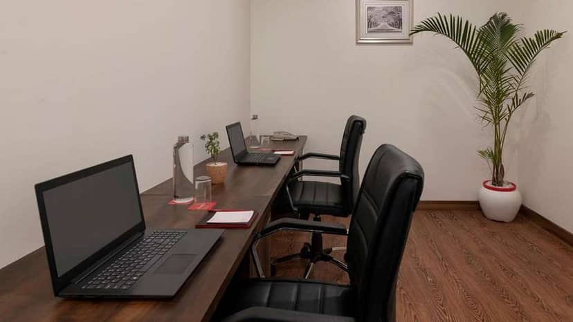 Sleek modern meeting room at Ramada Pitampura, ideal for collaborative work sessions.