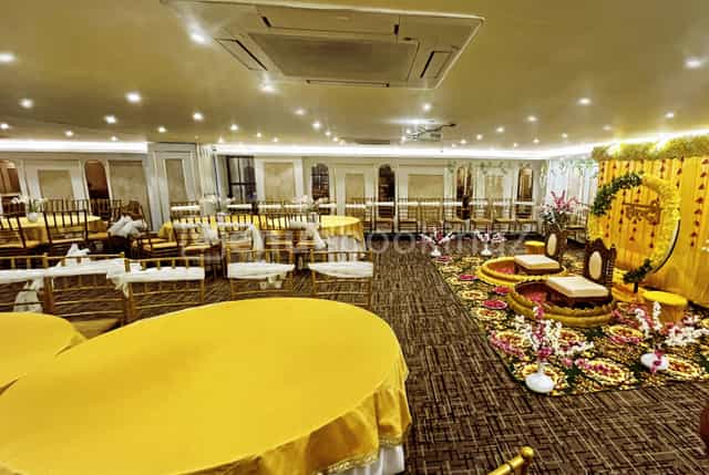 Elegant Banquet Hall with warm yellow decor, perfect for special events and celebrations.