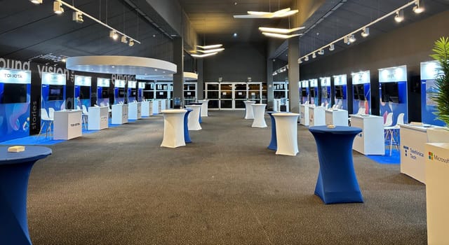Kinepolis Ciudad de la Imagen conference venue with modern design and display booths.