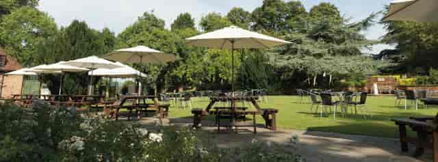 Spacious Front Lawn at Tudor Barn Eltham, perfect for summer events and gatherings.