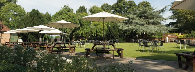 Spacious Front Lawn at Tudor Barn Eltham, perfect for summer events and gatherings.
