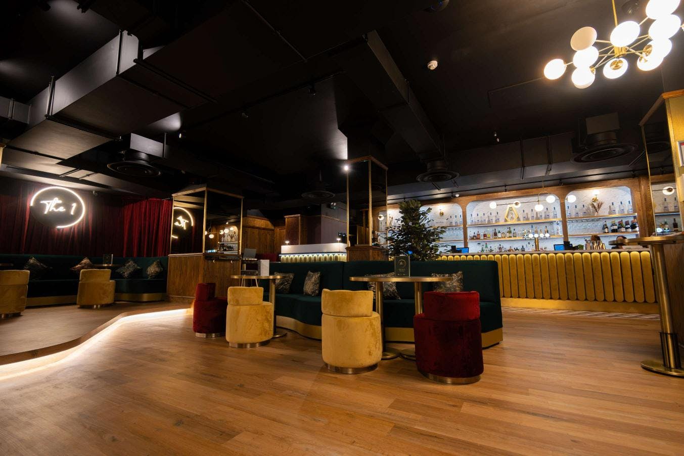 Semi-private hire area in The 1 Bar, featuring plush seating for networking events.