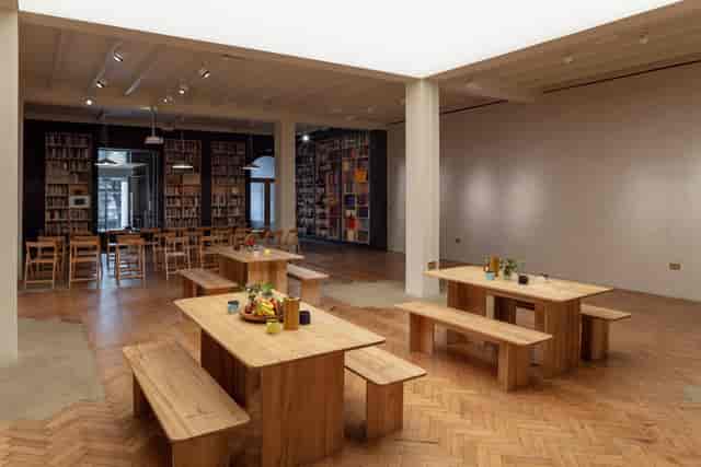 Crafts Council Gallery event space with wooden seating for intimate meetings and networking.