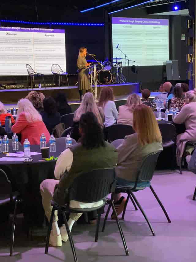 Conference attendees engaged in a presentation at The Hope Centre Auditorium.