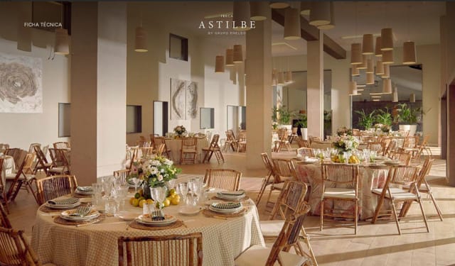 Elegant event space at Finca Astilbe with round tables, ideal for meetings and gatherings.