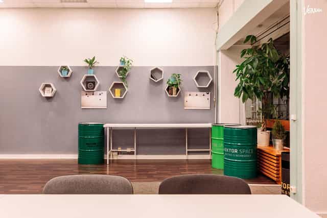 Modern workspace with hexagonal decor for meetings and events in Berlin.