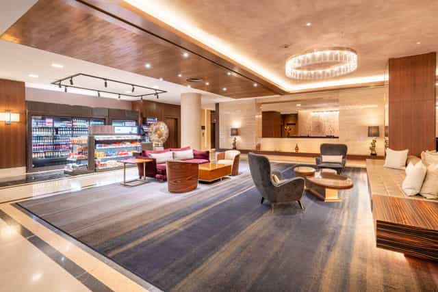Modern banquet hall in Hilton Berlin, stylish seating for networking events.