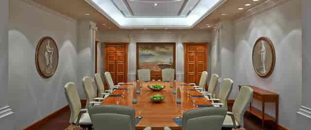 Elegant boardroom at Hilton Berlin with modern chairs, ideal for meetings and presentations.