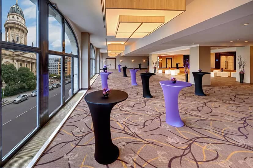 Elegant Hilton Berlin ballroom with modern decor, perfect for networking events and receptions.