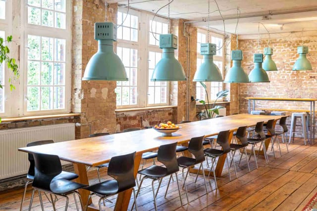 Spacious Fourth Room in LAB 4 with wooden table for collaborative workshops and meetings.