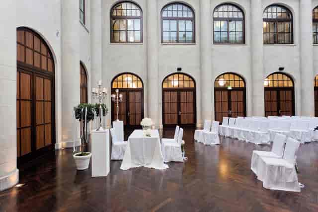 Elegant event space with arched windows, perfect for intimate ceremonies and receptions.