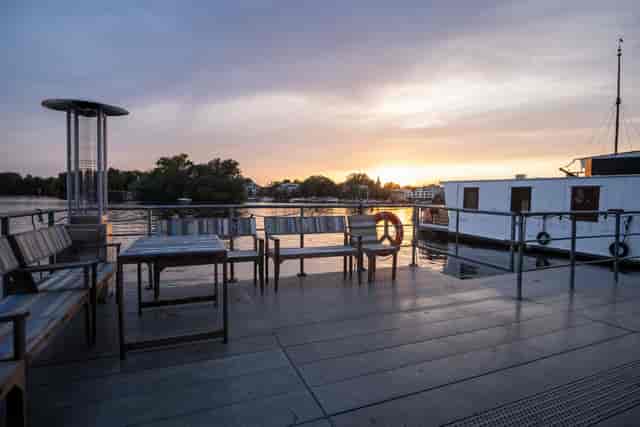 Outdoor conference room on a boat, perfect for intimate meetings and sunset receptions.