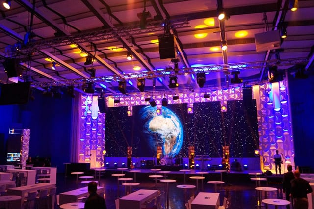 Modern event space in KOSMOS with vibrant lighting for conferences and presentations.