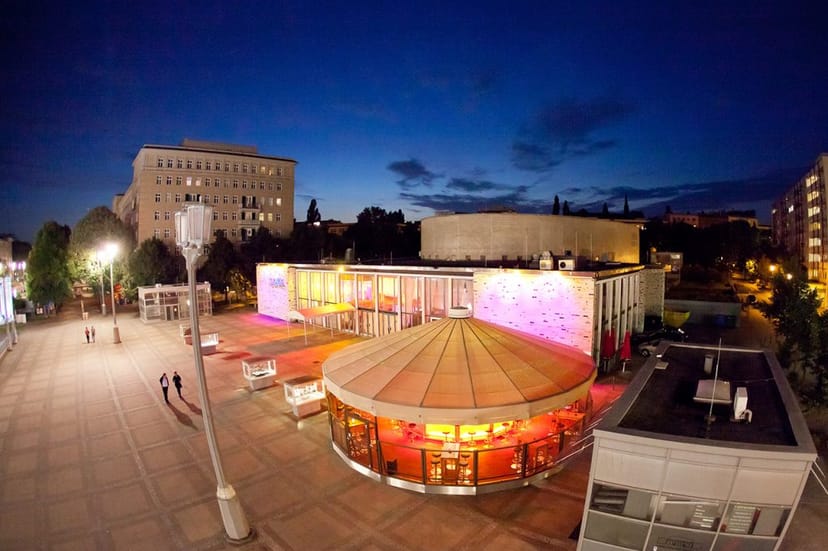 Vibrant KOSMOS event space with warm lighting, perfect for gatherings and corporate events.