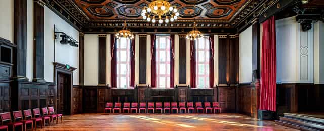 Elegant Meistersaal Berlin with ornate ceiling, ideal for conferences and formal events.