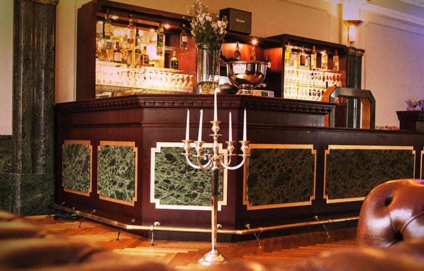 Elegant bar at Grüner Salon, Berlin - perfect for upscale events and networking.